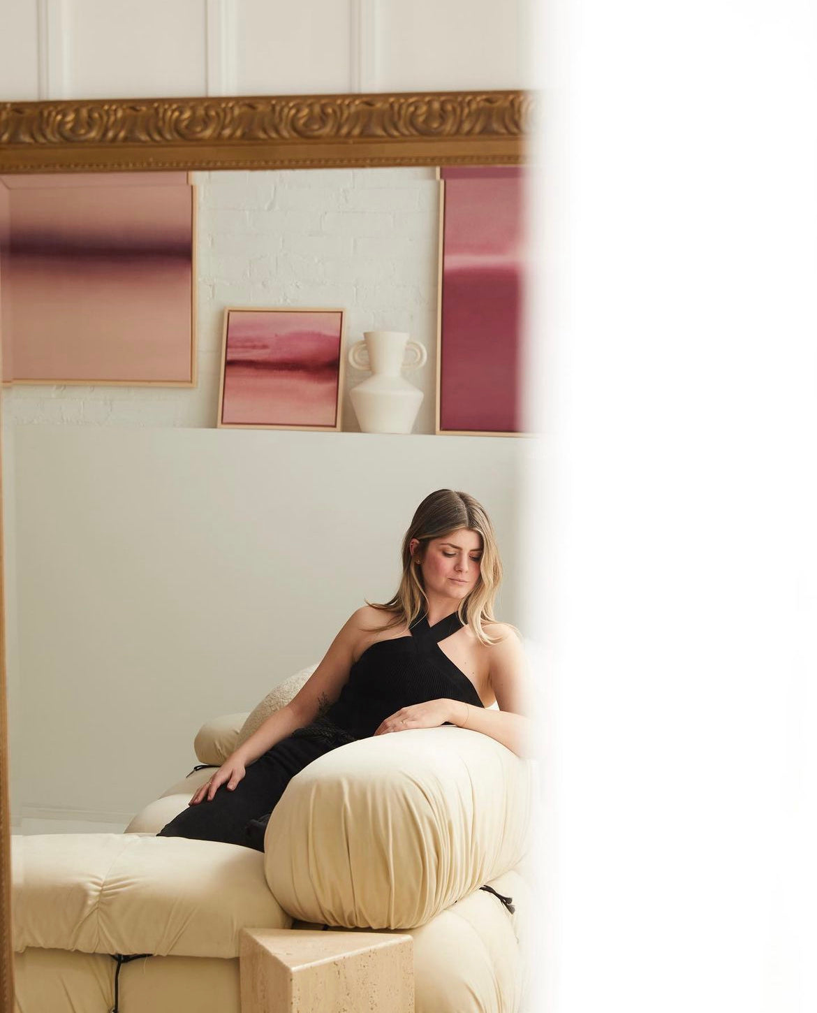 Abstract shades of pink gradient artwork shown in a living room