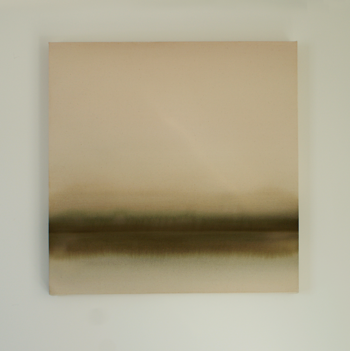 Abstract neutral and green artwork on the wall