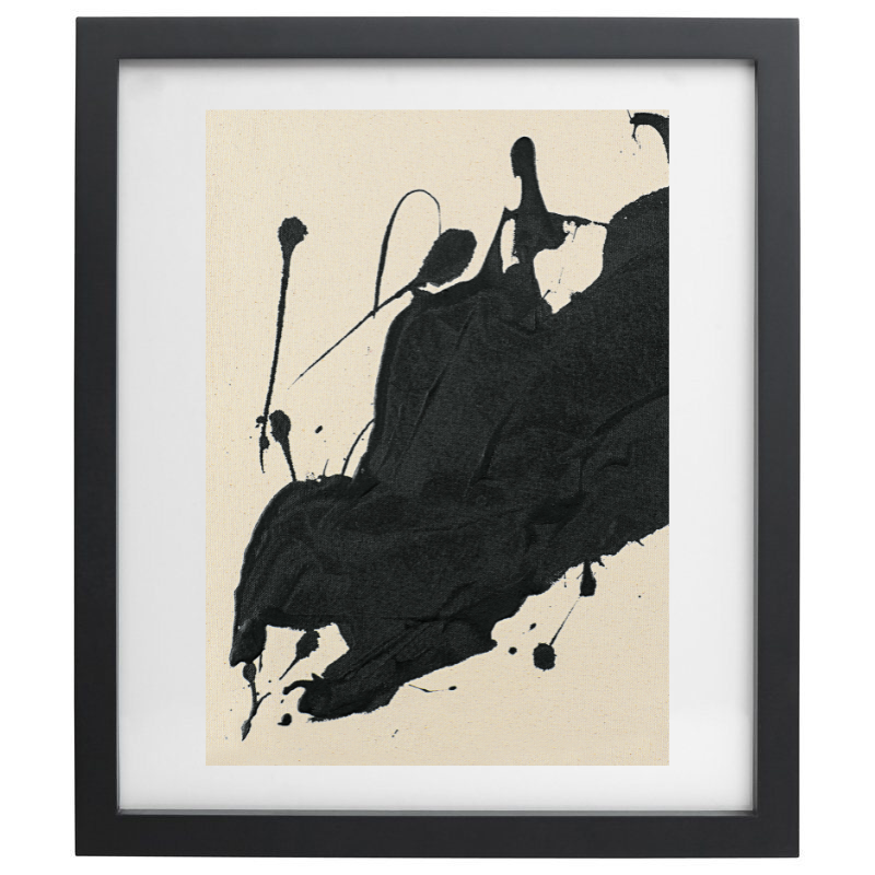 Abstract black paint splatter artwork in a black frame