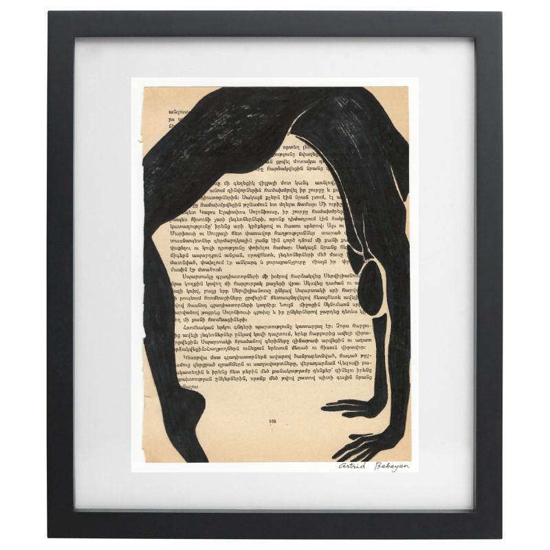 Minimalist artwork of a female form on top of a page of a book in a black frame