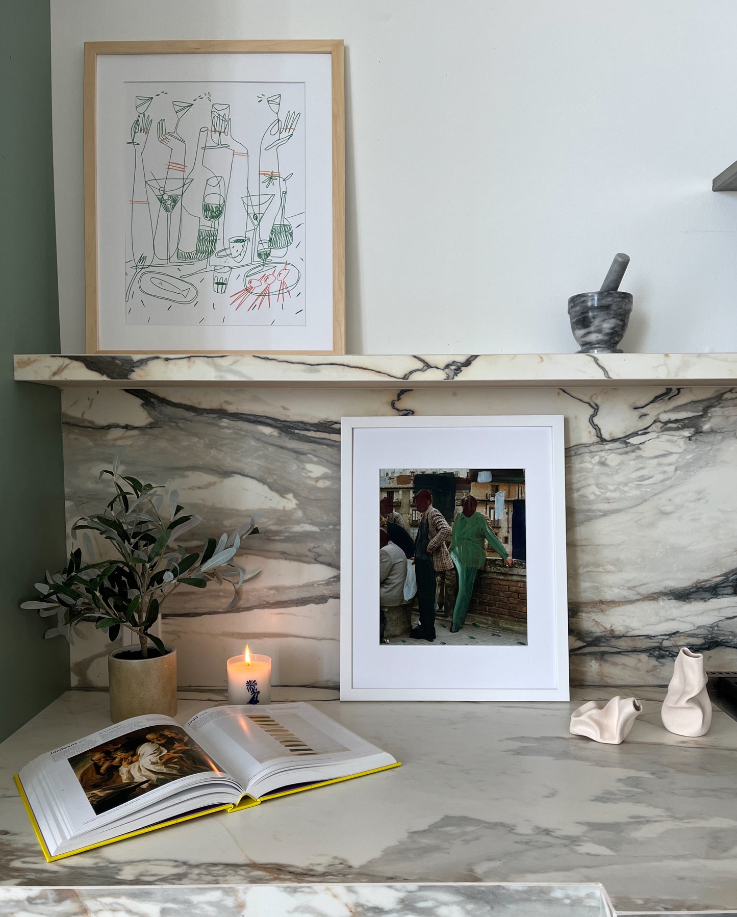 Abstract green and yellow martini artwork pictured in a kitchen