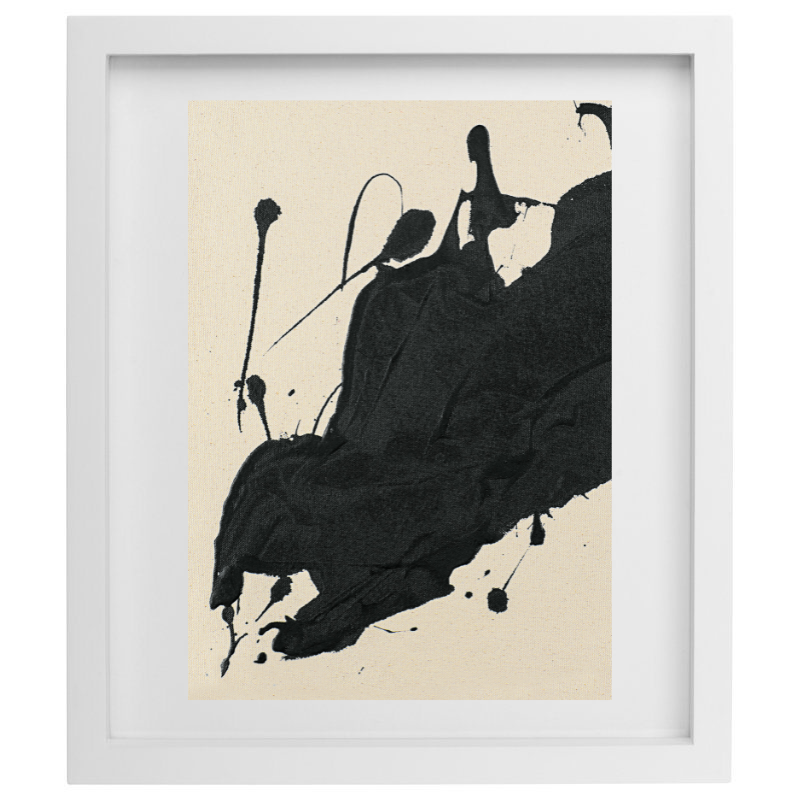 Abstract black paint splatter artwork in a white frame