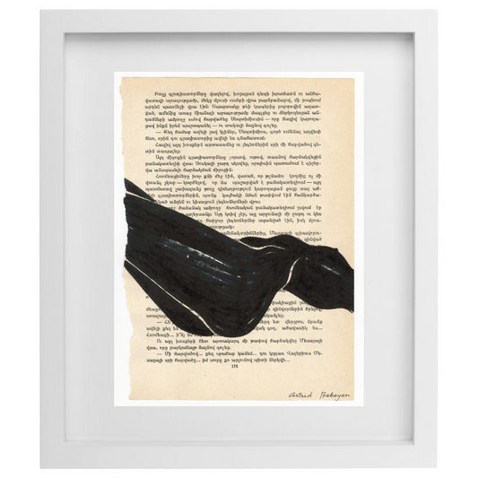 Minimalist artwork of a female form on top of a page of a book in a white frame