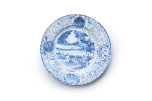 Blue and white porcelain plate with nature and human figure elements