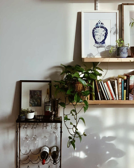 Blue and white vessel watercolour artwork on a shelf