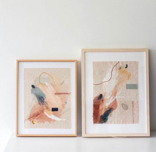 Abstract orange and blue artwork pictured leaning against a wall