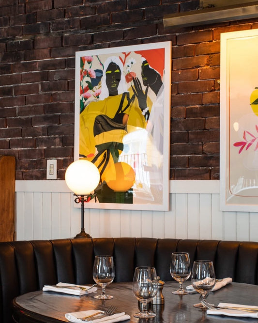 Female forms and florals colour blocked artwork pictured on the wall