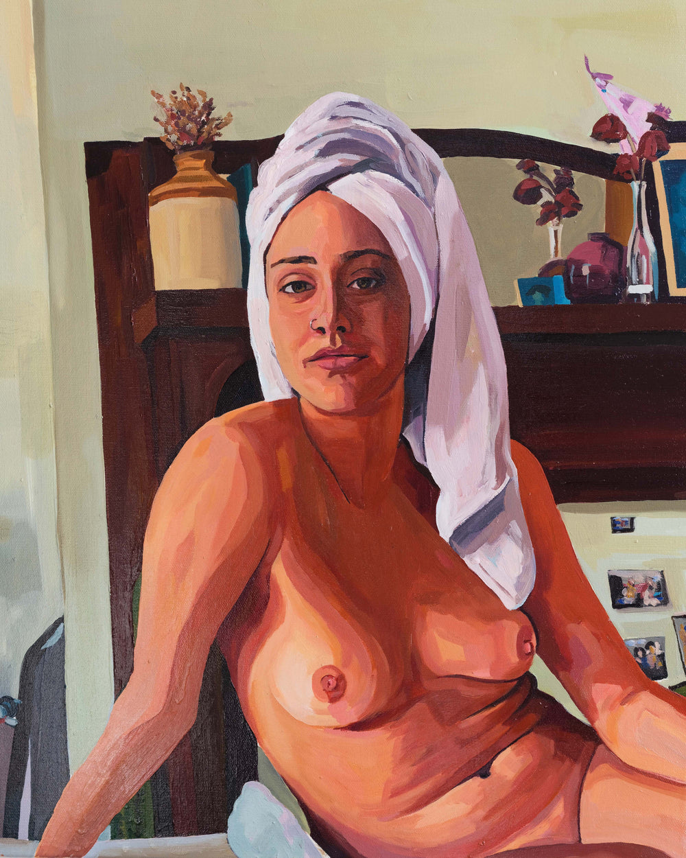 Artwork of a nude female figure sitting on a bed