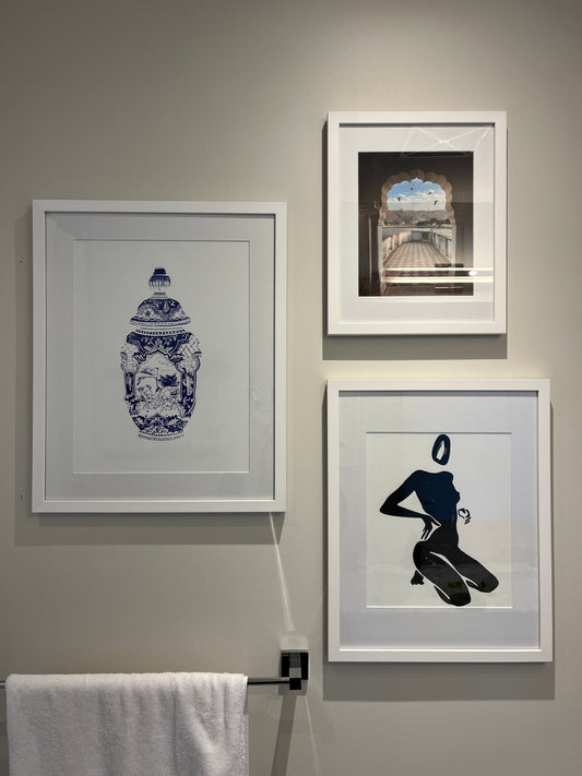 Blue and white watercolour vase with human figures on the wall