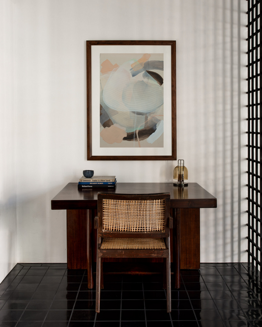 Abstract pastel and neutral colour artwork pictured above a desk