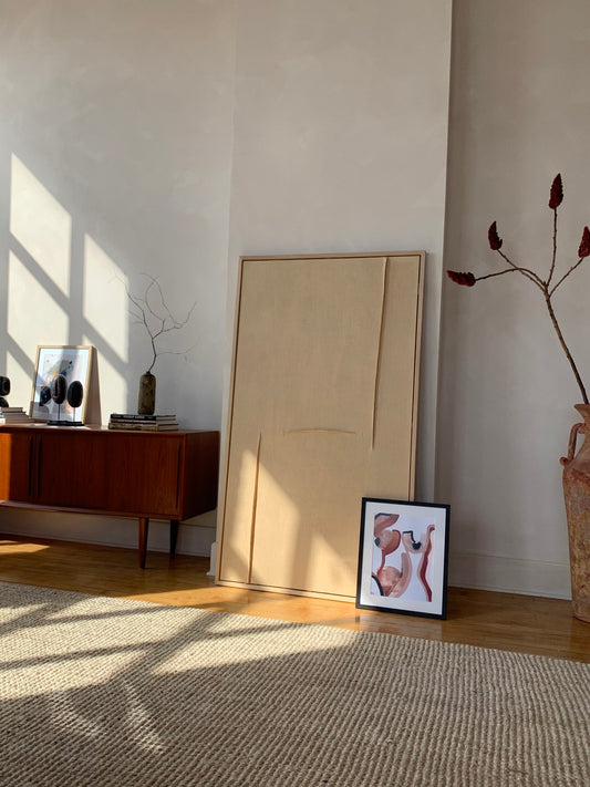 Abstract pinks and browns artwork pictured leaning against the wall