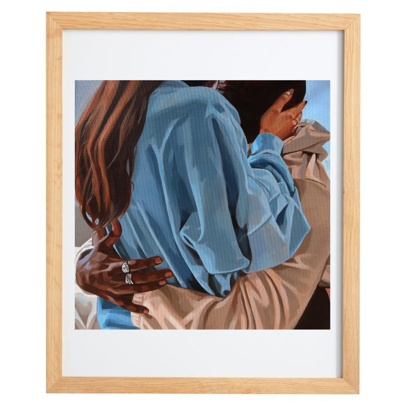 Blue, beige, and brown embrace artwork in a natural frame