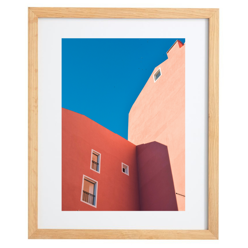 Orange buildings with blue skies photography in a natural frame