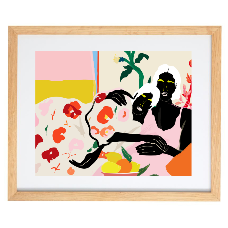 Two women cuddling colour blocked artwork in a natural frame