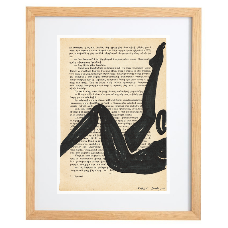 Minimalist artwork of a female form on top of a page of a book with a natural frame