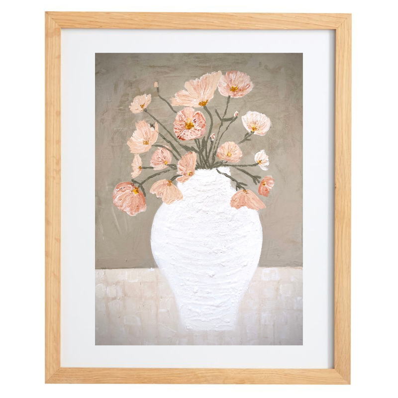 Artwork of a white vase with light pink flowers over a grey background with a natural frame