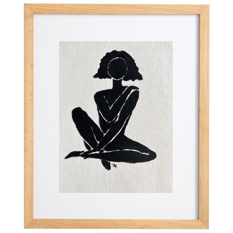 Black and white female figure artwork in a natural frame