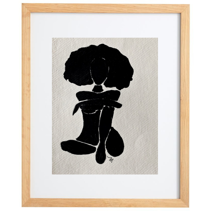 Black and white female figure artwork in a natural frame