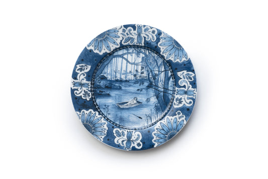 Blue and white porcelain plate artwork with nature designs