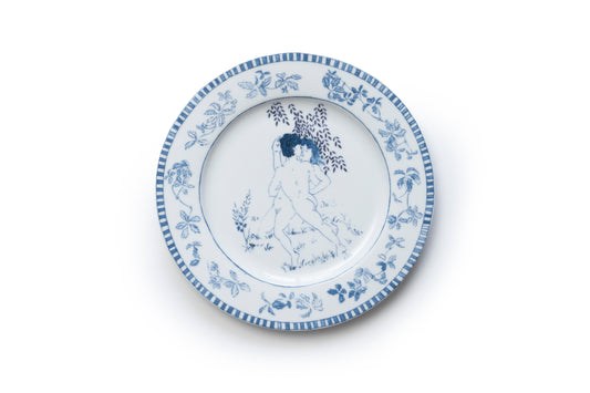 Blue and white porcelain plate with nature elements and human figures