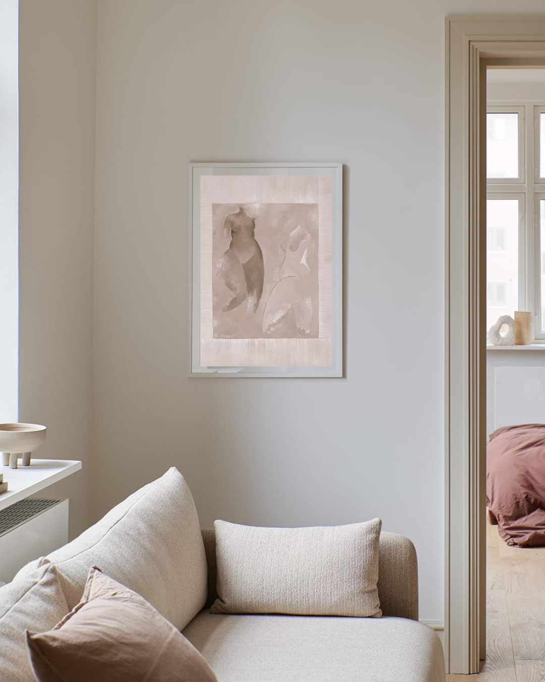 Naked female figure watercolour artwork in a neutral colour palette pictured on the wall