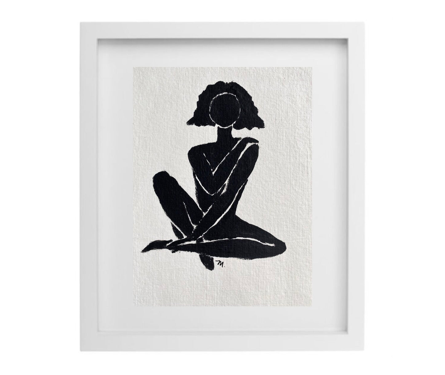 Black and white female figure artwork in a white frame