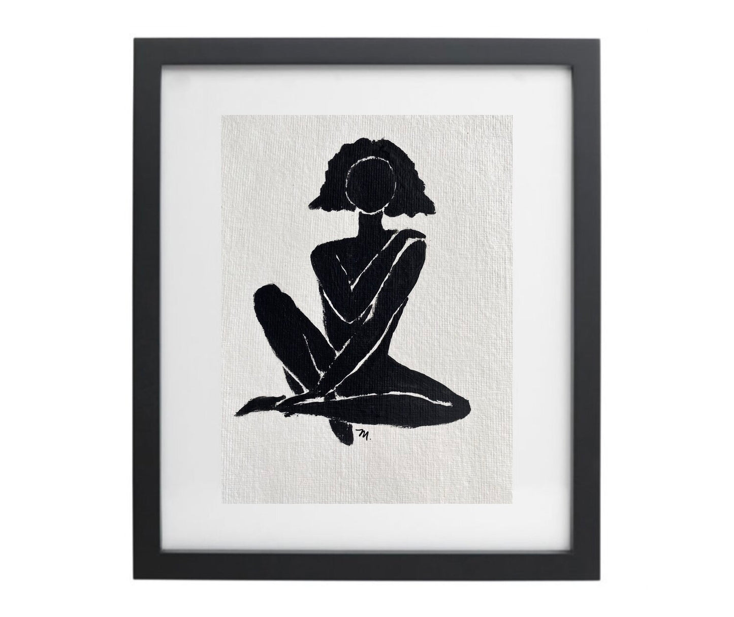 Black and white female figure artwork in a black frame