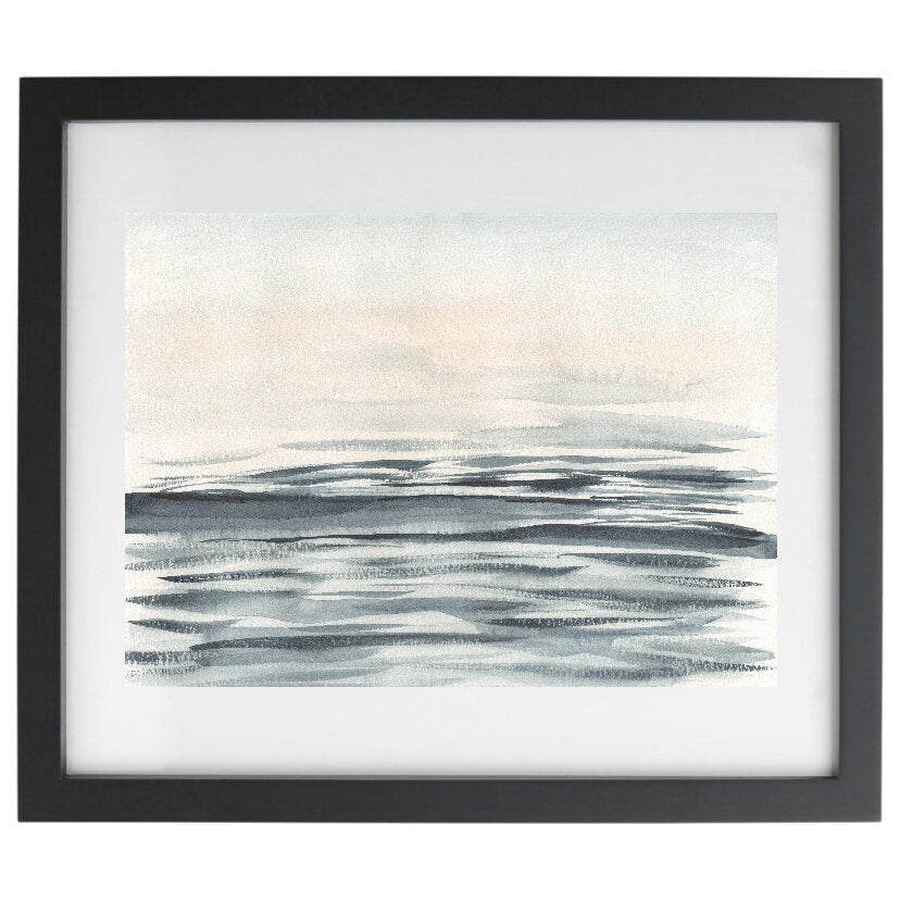 Abstract watercolour ocean artwork in a black frame