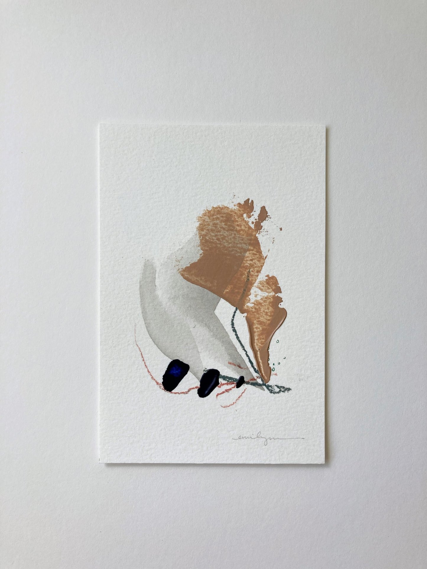 Minimalist neutral coloured artwork pictured on the wall