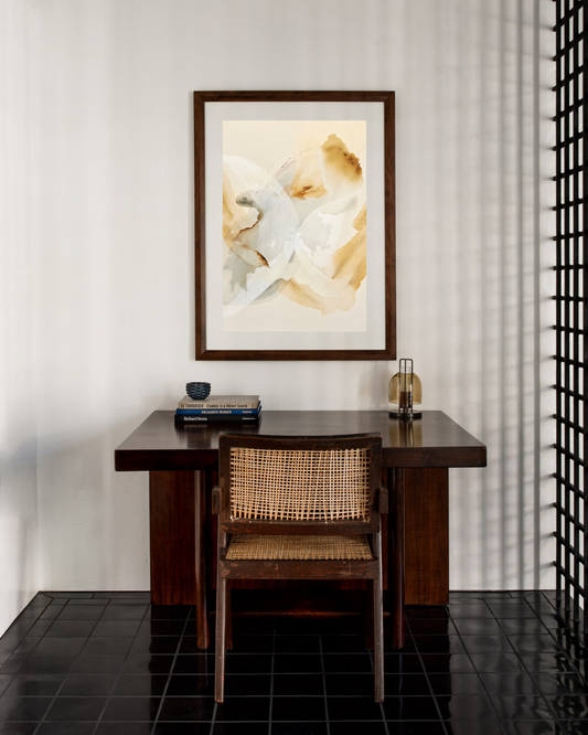 Neutral abstract artwork pictured above a desk