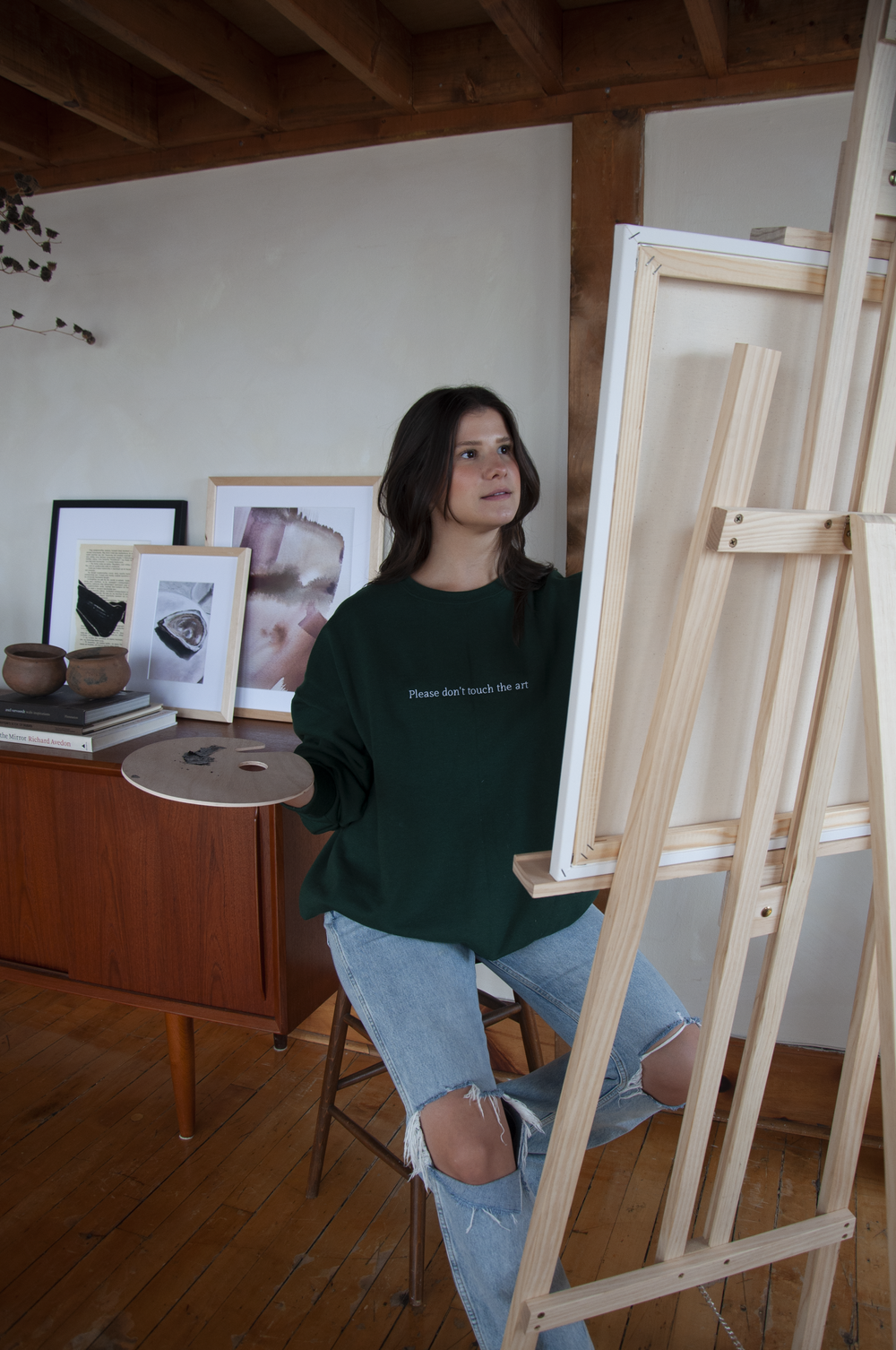 Tacit's "Please Don't Touch the Art" crewneck on model